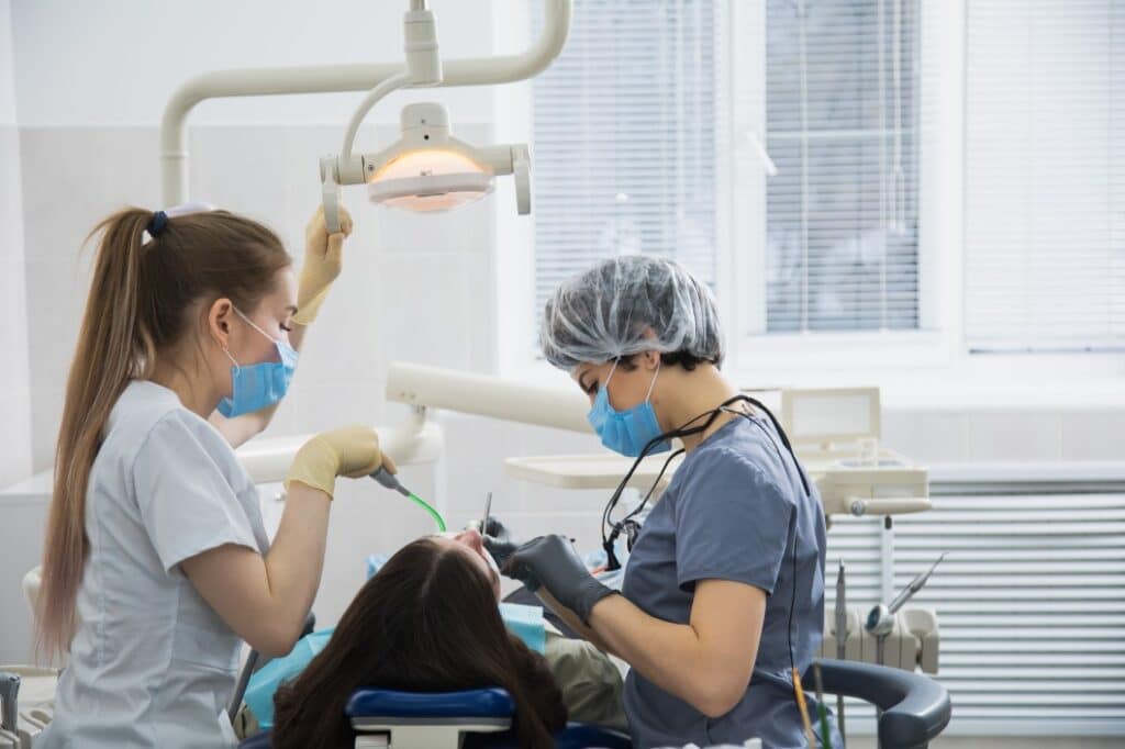 A Columbus family dentist performing cosmetic dentistry on a patient in Columbus, GA