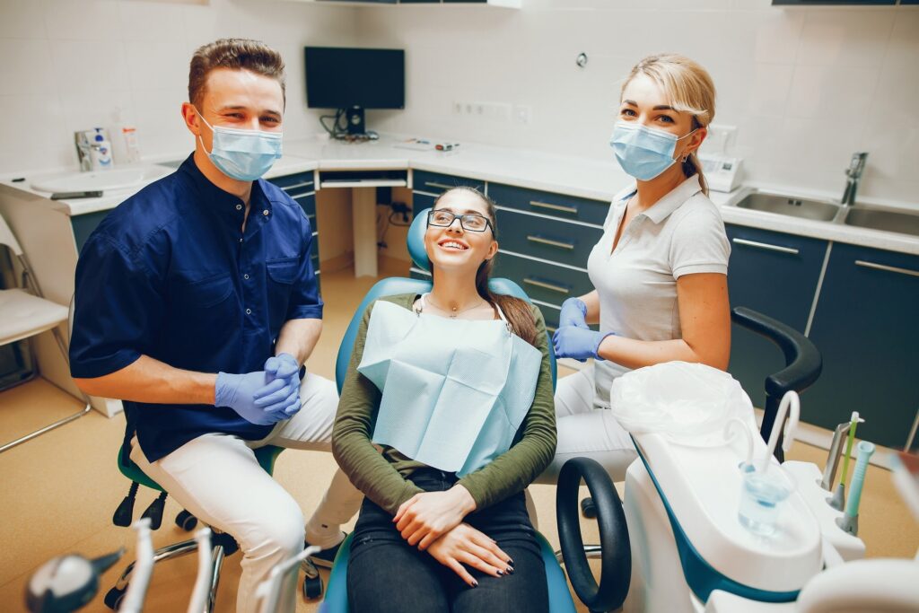 A young woman at a cosmetic dentist's office in Columbus, GA, prepares for a dental treatment