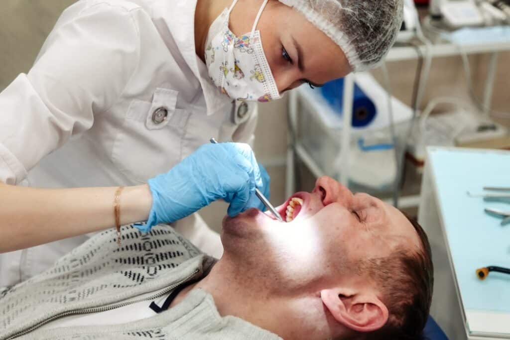 A man on a dental examination before the dental crown treatment in Columbus, GA