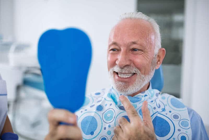 dental implants patient smiling after procedure, All-On-4 Full Implants