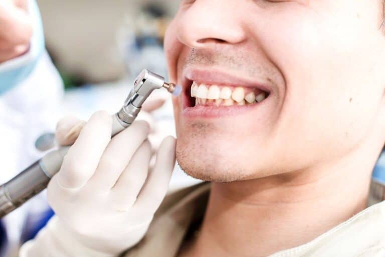 dentalpatient undergoing cleaning procedure, Do Regular Teeth Cleanings In Hamilton, GA Help Me?