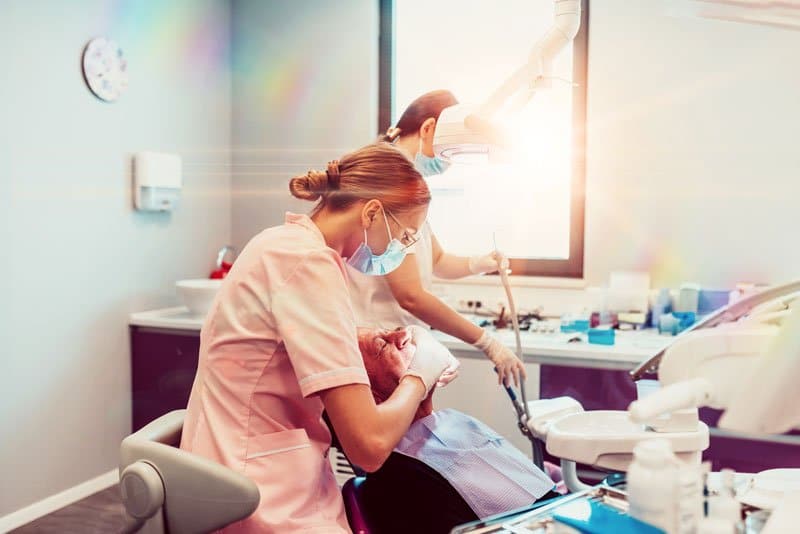 two nurses with an implant patient, Oral Sedation Dentistry