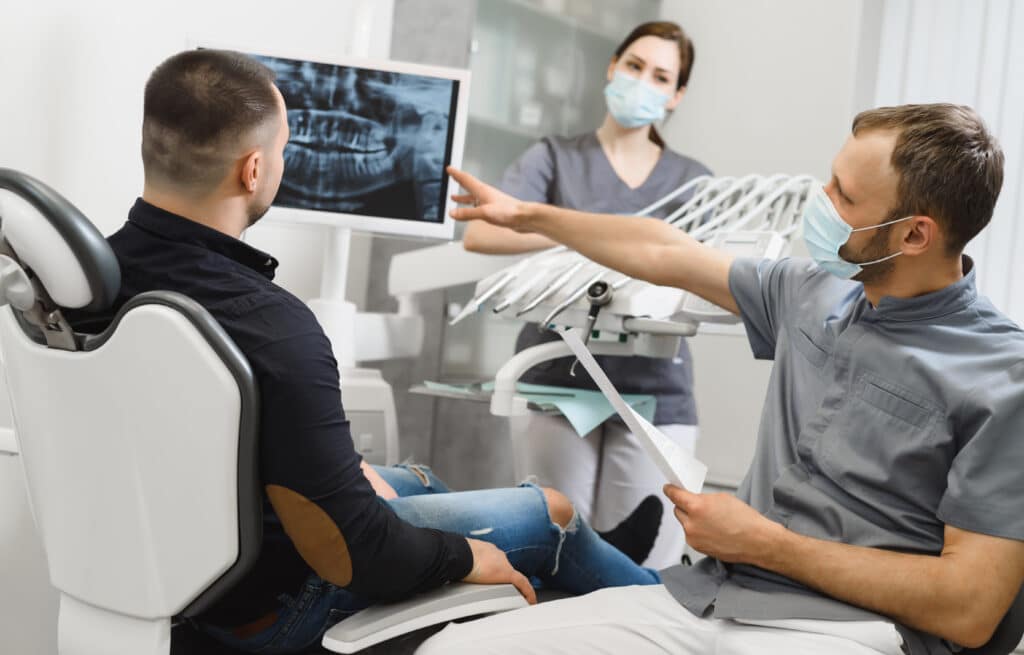 doctor reviewing xrays with patient, Bone Grafts