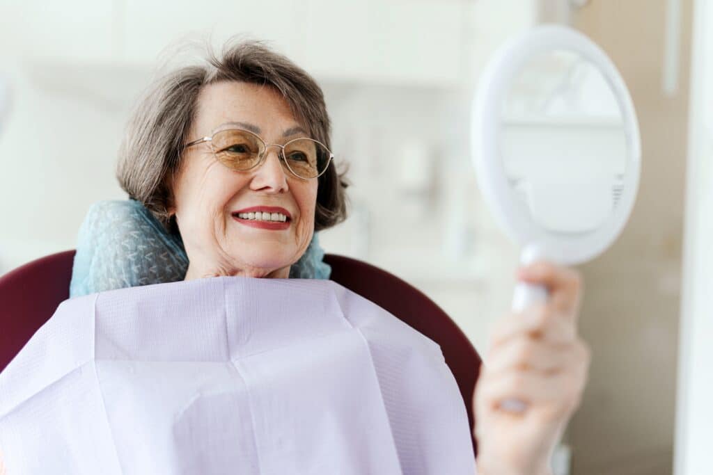 happy senior dental patient, Smile Makeovers