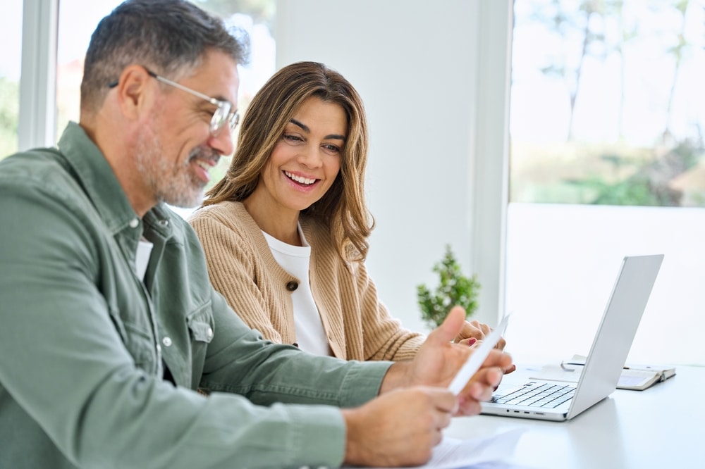 Couple browsing a website, scheduling a dental appointment