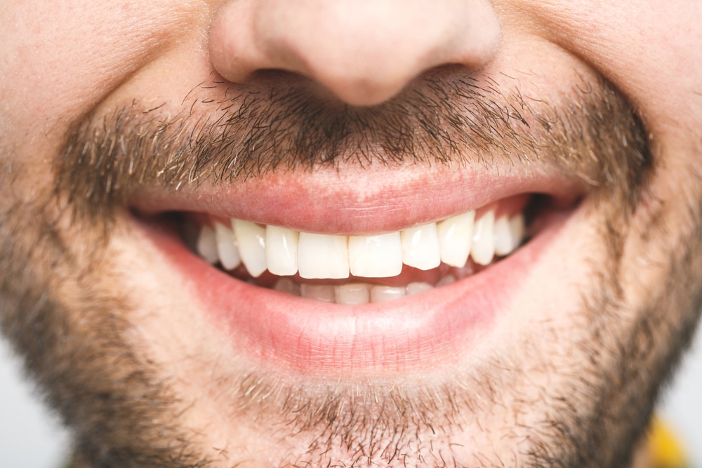 A close-up of a healthy man’s smile