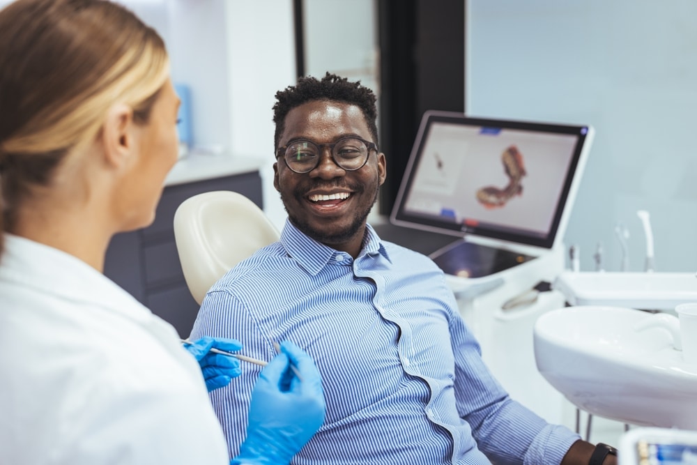 A happy patient looking at the dentist