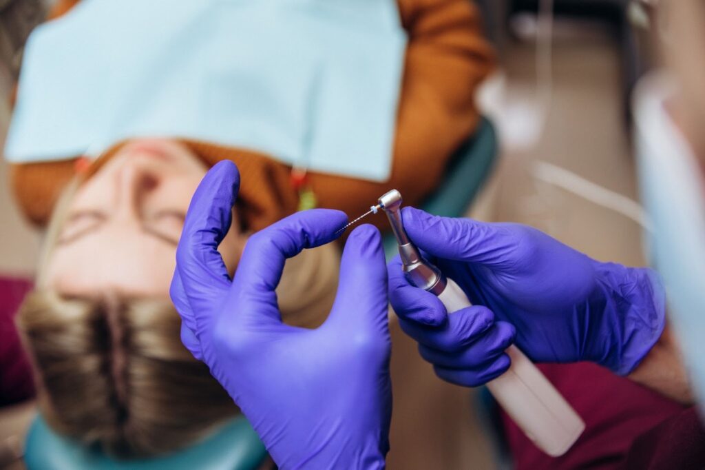 A close-up of a drill and needle for root canal treatment