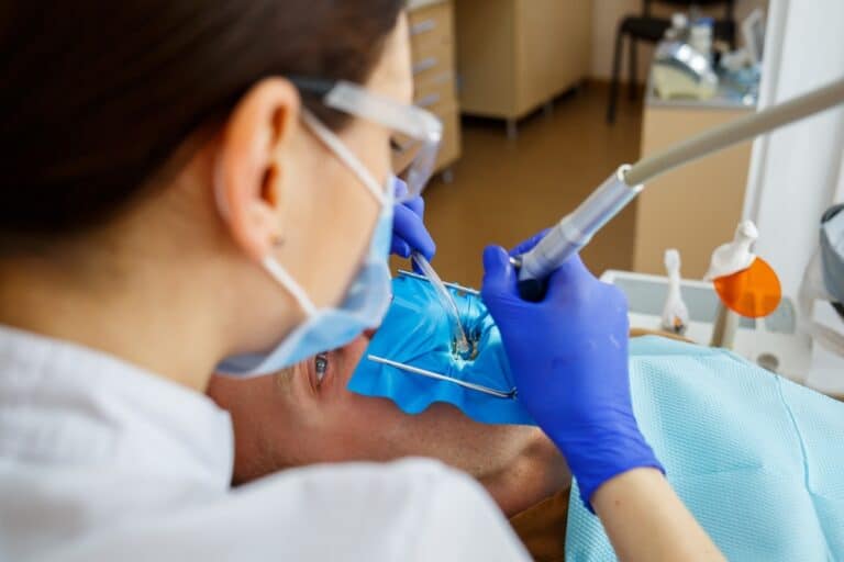 A close-up of the dentist’s tools during a root canal procedure