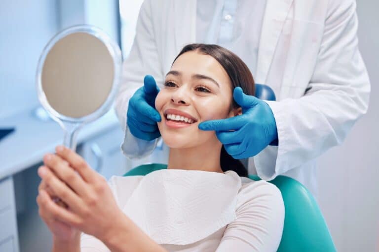 happy dental patient, How Much Does A Smile Makeover Cost?