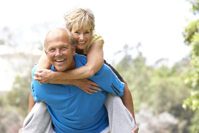 older couple smiling, Why Your Smile Looks Different in Your 40s, 50s, and Beyond — And What You Can Do About It