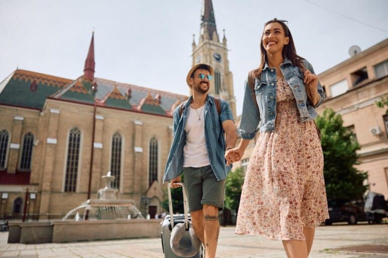 happy couple traveling, Traveling This Summer? Don’t Forget to Pack Your Best Smile!